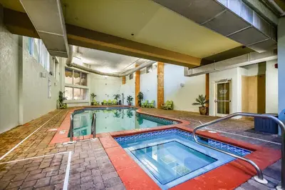 an indoor swimming pool in a building at Shores of Panama 630-1BdBunks, Sleeps 6, Beach Front! Free Fun! Reserved Parking Space condo in Panama City Beach