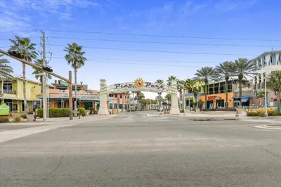 an empty street in a town with palm trees at Shores of Panama 2330 - 1 Bedroom Bunk Area Sleeps 6, Beautiful Direct Beach View! Free Fun! condo in Panama City Beach