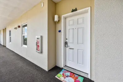 a door in a hallway with a mat in front of it at Laketown Wharf 835 - Very Cool 1 BedroomBunks, Sleeps 6, Free Fun! condo in Panama City Beach