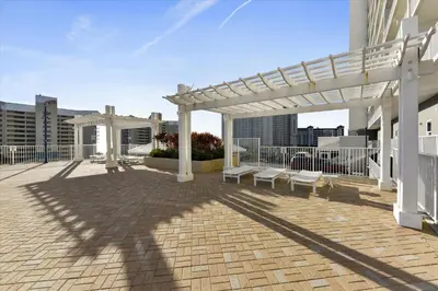 a pavilion with benches and a crosses on a building at Laketown Wharf 835 - Very Cool 1 BedroomBunks, Sleeps 6, Free Fun! condo in Panama City Beach