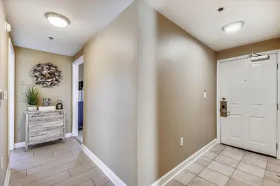 a hallway of a home with a white door at Shores of Panama 1804 - 2 Bedroom Bunkroom Sleeps 8, Updated! Free Fun, condo in Panama City Beach