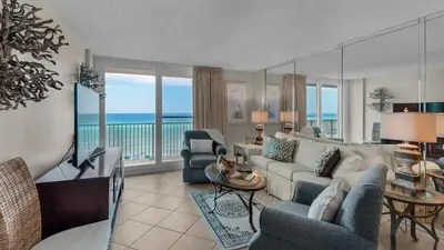 a living room with a view of the ocean at Beachcrest 405 in Santa Rosa Beach