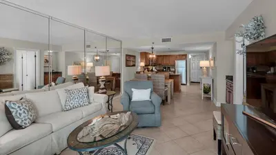 a living room with a white couch and a table at Beachcrest 405 in Santa Rosa Beach
