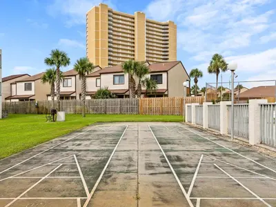 an empty basketball court in front of a building at Endless Summer #A27 in Panama City Beach