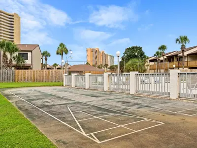 a basketball court in a yard with a fence at Endless Summer #A27 in Panama City Beach