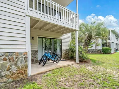 a pair of bikes parked on the porch of a house at Cassine Gardens 112- 30A Imagine Ocean in Santa Rosa Beach