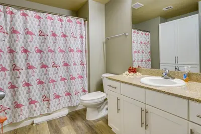 a bathroom with a toilet and a shower curtain at PCB Vacation Rental with Balcony and Beach Access! in Panama City Beach