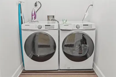 two washing machines sitting next to each other in a room at Ocean Reef 1106 - Lazy Daze in Panama City Beach