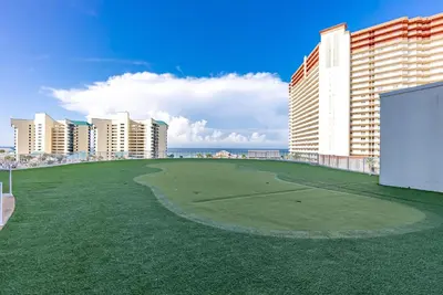 a golf course in the middle of a city with buildings at Luxury Gulf-View 3BD Condo! Free Beach Chairs! by Dolce Vita Getaways PCB in Panama City Beach