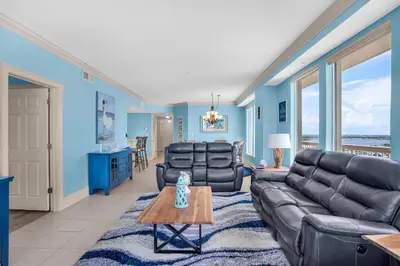 a living room with a couch and a table at Seychelles 1601 in Panama City Beach