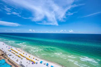an overhead view of a beach with people and the ocean at Seychelles 1601 in Panama City Beach