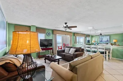 a living room with a couch and a table at The Summit 1512 in Panama City Beach