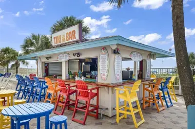 a food cart with colorful chairs and tables at The Summit 1512 in Panama City Beach