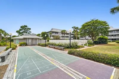 a tennis court in front of a building at 30A Beachwood Villas by Panhandle Getaways in Santa Rosa Beach