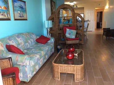 a living room with a couch and a table at Panama City Beach Condo at Sunrise Resort in Panama City Beach