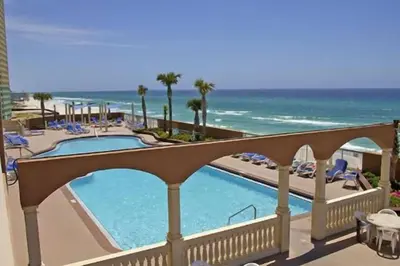 a resort with a swimming pool and the beach at Panama City Beach Condo at Sunrise Resort in Panama City Beach