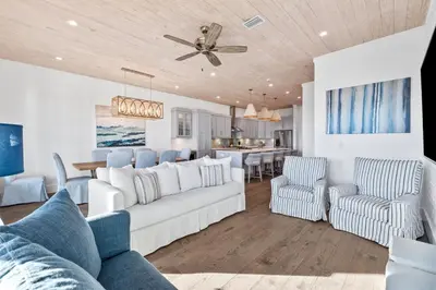 a living room with a white couch and chairs at Peaceful Easy Feeling - 156 Chivas Lane, Unit B home in Santa Rosa Beach