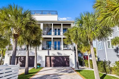 a white house with palm trees in front of it at Peaceful Easy Feeling - 156 Chivas Lane, Unit B home in Santa Rosa Beach