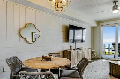 a dining room with a table and chairs at Calypso Resort Tower 3 Unit 711 in Panama City Beach
