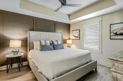a bedroom with a bed and a ceiling fan at Calypso Resort Tower 3 Unit 711 in Panama City Beach