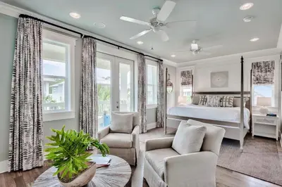 a bedroom with a bed and a living room at Green Wave in Inlet Beach