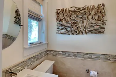 a bathroom with a sink and a mirror at Green Wave in Inlet Beach
