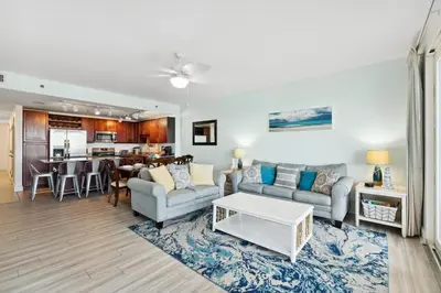 a living room with a couch and a table at Remodeled 3BD plus Bunks! Low Floor Family Beach Resort! 5 Pools! by Dolce Vita Getaways PCB in Panama City Beach