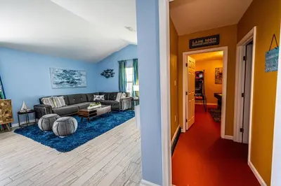 two different views of a living room and a living room at Vacation Home near Beach and Waterpark! in Panama City Beach