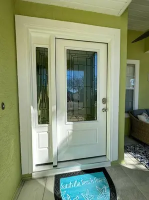 a front door of a house with a window at Vacation Home near Beach and Waterpark! in Panama City Beach