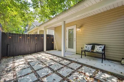 a porch with a bench on a house at Panama City Beach Vacation Rental about 1 Mi to Beach! in Panama City Beach