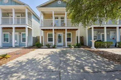 a house with a driveway in front of it at Panama City Beach Vacation Rental about 1 Mi to Beach! in Panama City Beach