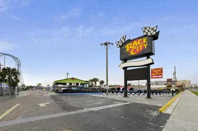 a large krispy kreme sign next to a parking lot at Cove Cottage - 3 Bedroom withPrivate Pool, Sleeps 6, Quiet Community, Close to Fishing Marinas, home in Panama City