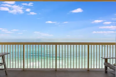 a view of the ocean from the balcony of a resort at Calypso Resort Serenity 1 in Panama City Beach
