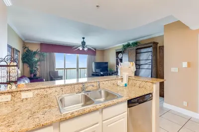 a kitchen with a sink and a counter top at Calypso Resort Serenity 1 in Panama City Beach