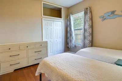 a bedroom with two beds and a dresser and a window at Pet-Friendly Panama City Beach Home Near Beaches! in Panama City Beach