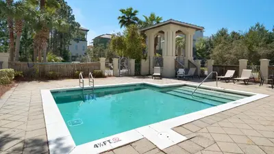 a swimming pool in a yard with a gazebo at Seagrove Serenity in Santa Rosa Beach
