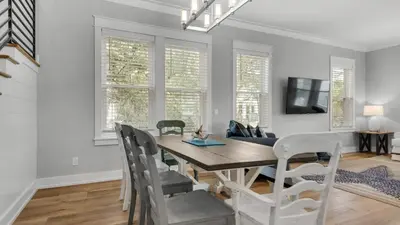 a dining room with a table and chairs at Seagrove Serenity in Santa Rosa Beach
