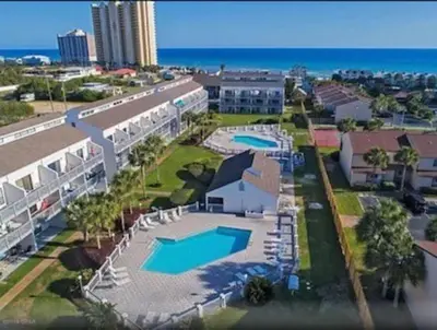 an aerial view of a resort with two swimming pools at FullyRenovated 1 min walk2 beach.5min to peir park in Panama City Beach