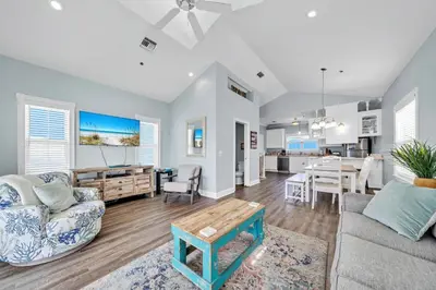 a living room with a couch and a table at Summer Towne Cottages #8 - Sea-Questered in Panama City Beach