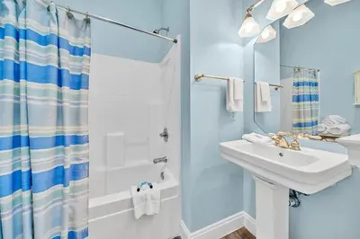 a bathroom with a sink and a shower at Summer Towne Cottages #8 - Sea-Questered in Panama City Beach