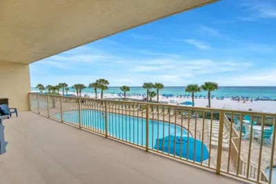a balcony with a view of the beach and the ocean at Gulfcrest 206 in Panama City Beach