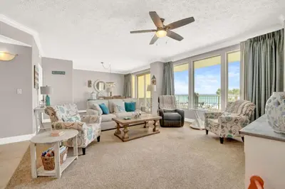 a living room with a couch and a table at Gulfcrest 206 in Panama City Beach