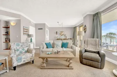 a living room with a couch and a table at Gulfcrest 206 in Panama City Beach