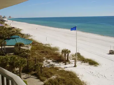 a view of a beach with a blue flag at Boardwalk Beach Hotel in Panama City Beach