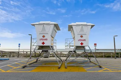 two lifeguard stations sitting in a parking lot at Edgewater Beach Resort #207 Tower 2 by Book That Condo in Panama City Beach