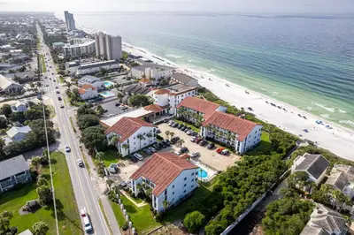 an aerial view of the beach and buildings at Psalms in Santa Rosa Beach