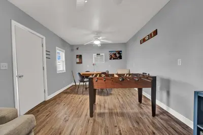 a living room with a ping pong table in it at Loaded House and Guest House w Game Room Gym in Panama City