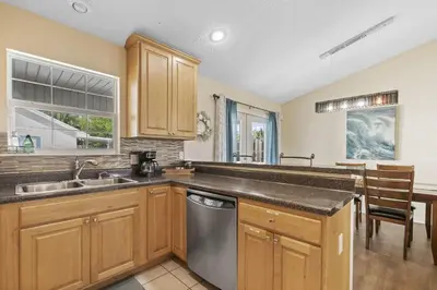 a kitchen with a sink and a dishwasher at Escape to Paradise w Saltwater Pool 25 Min to PCB in Panama City