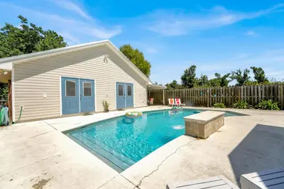 a swimming pool in the backyard of a house at Luxe Pool Casita w Saltwater Pool 25 Min to PCB in Panama City
