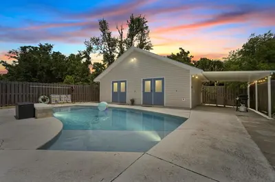a swimming pool in front of a house at Luxe Pool Casita w Saltwater Pool 25 Min to PCB in Panama City